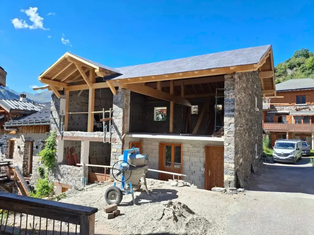 Chalet La Grange exterior renovation with timber roof frame