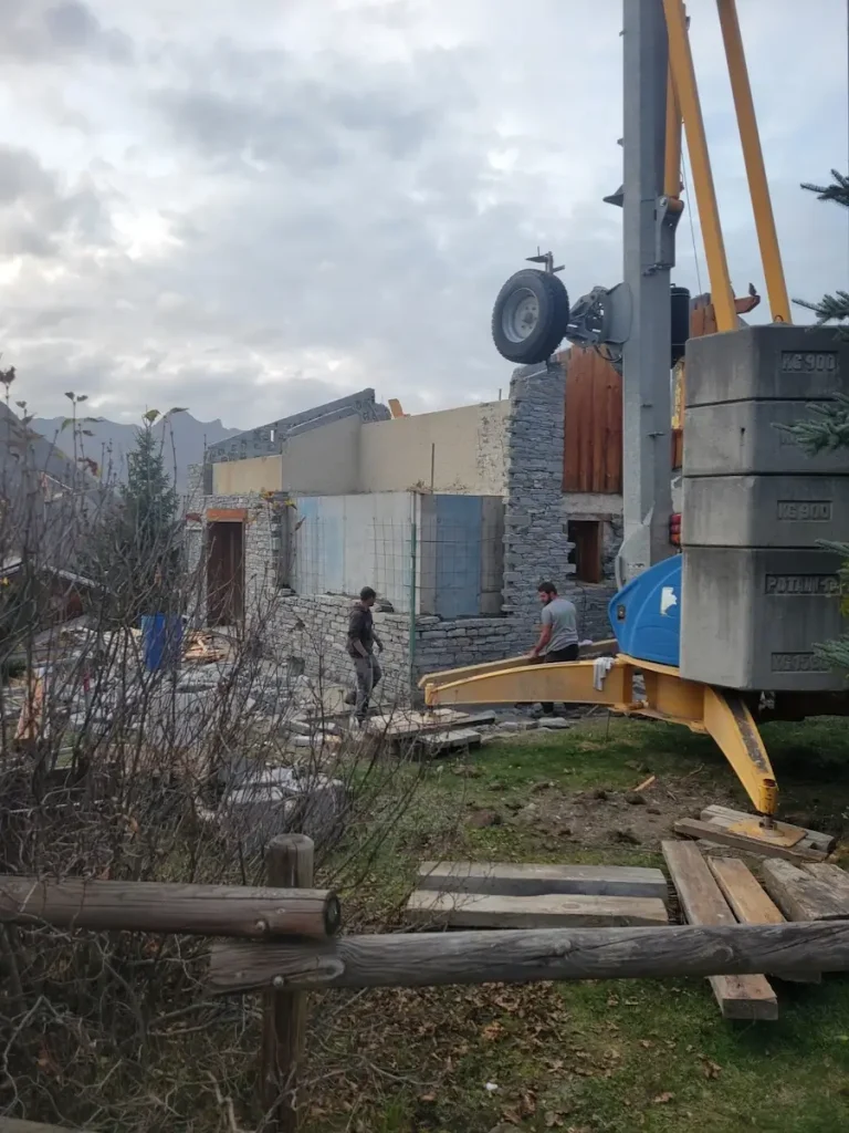 Side view of chalet renovation works in winter