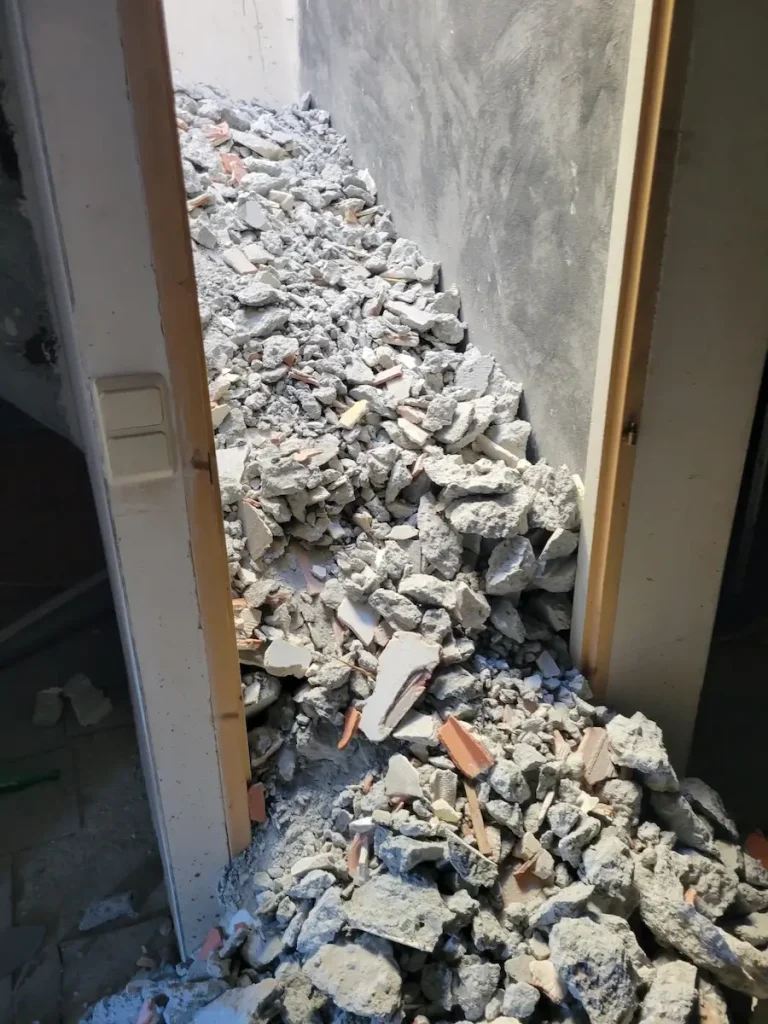 Stone drainage channel beside chalet under renovation