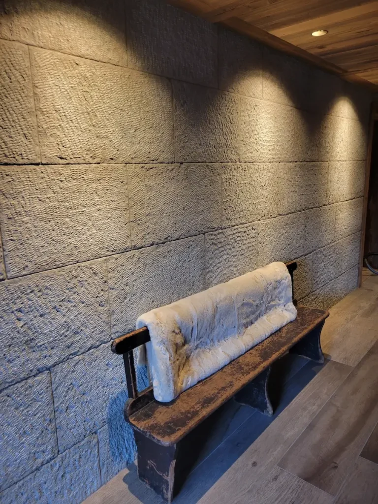 Stone feature wall and bench at Chalet La Rochette