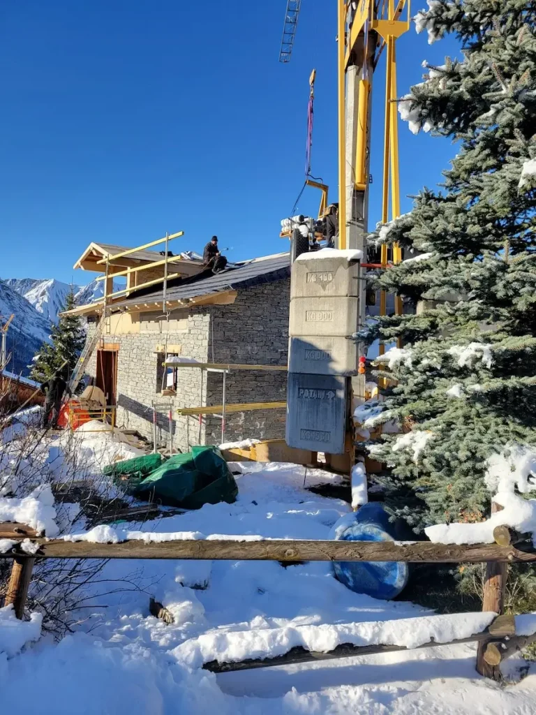 Crane working beside chalet renovation site