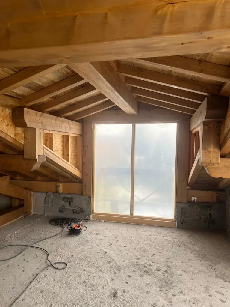 Timber loft bedroom at Chalet La Rochette
