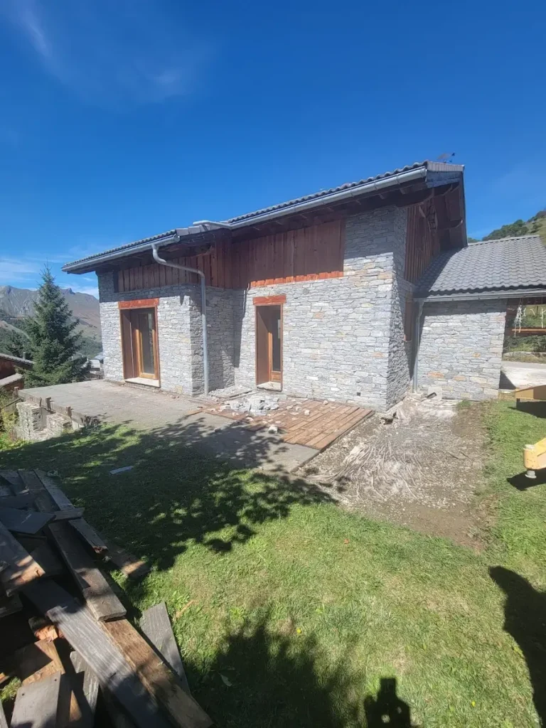 Chalet exterior after renovation with garden area
