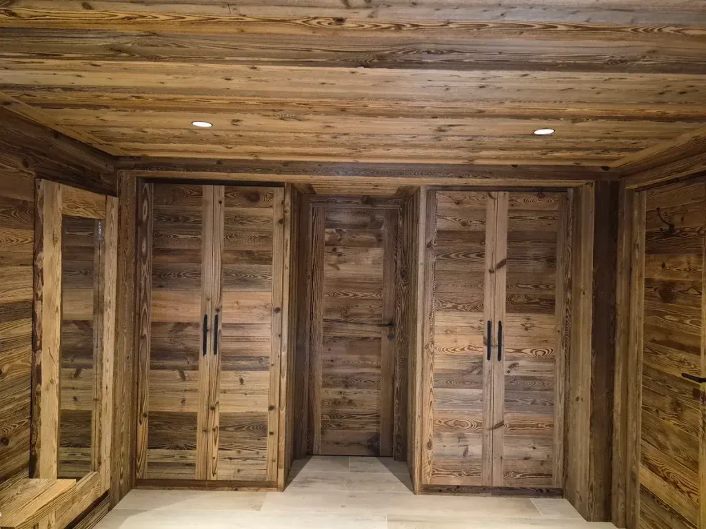 Bespoke wooden wardrobe and storage wall with integrated shelving